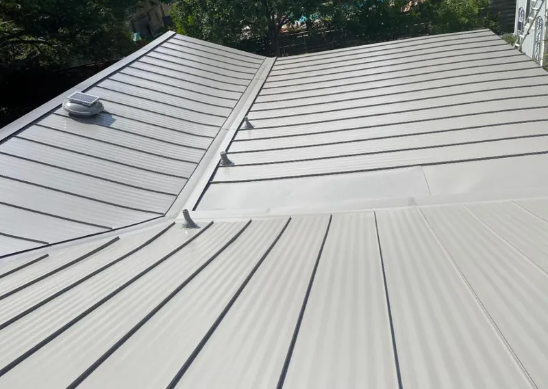Solar attic fan installed on a metal roof for Roof Ventilation in Maurice River